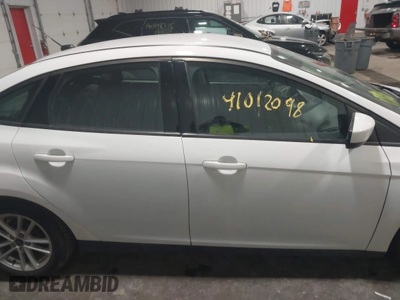 2018 Ford Focus SE with VIN 1FADP3F29JL312721, listed as a IAAI auction lot 41012098 with 126,214 mi miles. Bid and sale history available at carsss.com. Image 13.