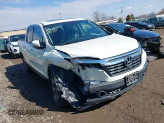 2019 Honda Ridgeline RTL z VIN 5FPYK2F5XKB004418, wystawiony jako IAAI lot #41662015 z przebiegiem 69 994 mil mil oraz . Historia ofert i sprzedaży dostępna na DreamBid. Obrazek 1.