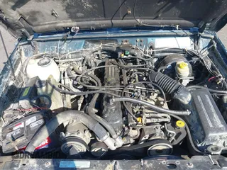 1995 Jeep Cherokee Sport z VIN 1J4FJ68S7SL623451, wystawiony jako IAAI lot #42581407 z przebiegiem 160 581 mil mil oraz . Historia ofert i sprzedaży dostępna na DreamBid. Obrazek 10.