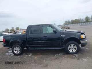 2002 Ford F-150 XLT with VIN 1FTRW08L32KD90202, listed as a IAAI auction lot 41850546 with 256,807 mi miles. Bid and sale history available at carsss.com. Image 13.