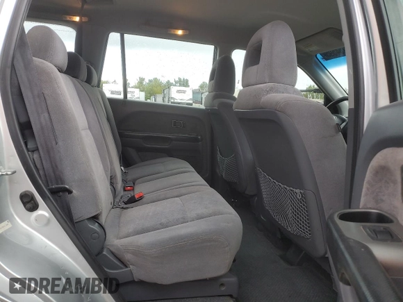2005 Honda Pilot LX z VIN 2HKYF18195H511883, wystawiony jako Copart lot #53754595 z przebiegiem 269 419 mil mil oraz Szkoda całkowita • Salvage title. Historia ofert i sprzedaży dostępna na DreamBid. Obrazek 11.
