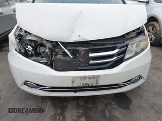 2014 Honda Odyssey Touring with VIN 5FNRL5H94EB001479, listed as a IAAI auction lot 41123678 with 147,269 mi miles and . Bid and sale history available at carsss.com. Image 6.