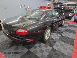 1997 Jaguar XK with VIN SAJGX5748VC006720, listed as a Copart auction lot 80928284 with 96,279 mi miles and Clean Title. Bid and sale history available at DreamBid. Image 4.