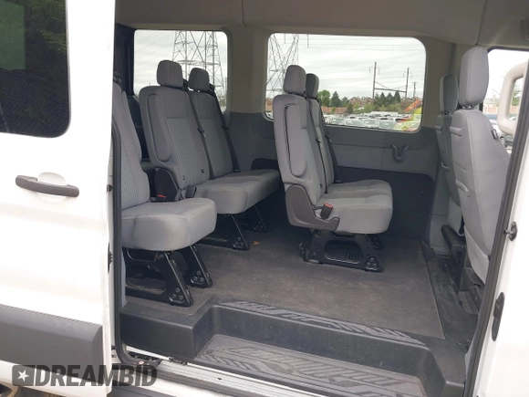 2017 Ford Transit Passenger XL z VIN 1FMZK1CM8HKA67270, wystawiony jako IAAI lot #42074459 z przebiegiem 50 461 mil mil oraz . Historia ofert i sprzedaży dostępna na DreamBid. Obrazek 8.