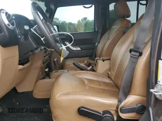 2014 Jeep Wrangler Unlimited Sahara with VIN 1C4HJWEG7EL299548, listed as a Copart auction lot 58522355 with 76,057 mi miles and Clean title. Bid and sale history available at DreamBid. Image 7.