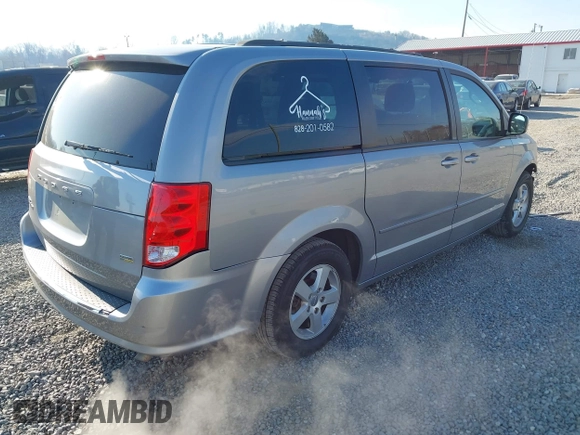 2013 Dodge Grand Caravan SXT with VIN 2C4RDGCG3DR553217, listed as a IAAI auction lot 41898964 with 101,989 mi miles and . Bid and sale history available at DreamBid. Image 4.
