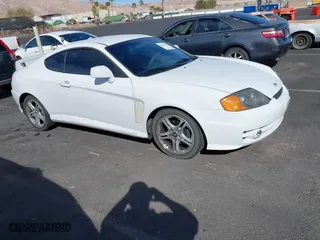 2004 Hyundai Tiburon GT with VIN KMHHN65FX4U130771, listed as a IAAI auction lot 41754074 with 126,711 mi miles. Bid and sale history available at carsss.com. Image 1.