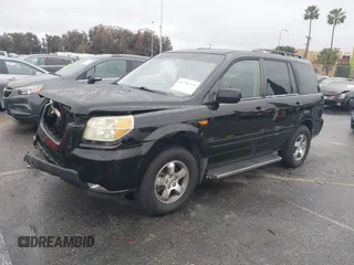 2007 Honda Pilot EX-L with VIN 2HKYF18557H500711, listed as a IAAI auction lot 41794731 with 168,553 mi miles. Bid and sale history available at carsss.com. Image 2.
