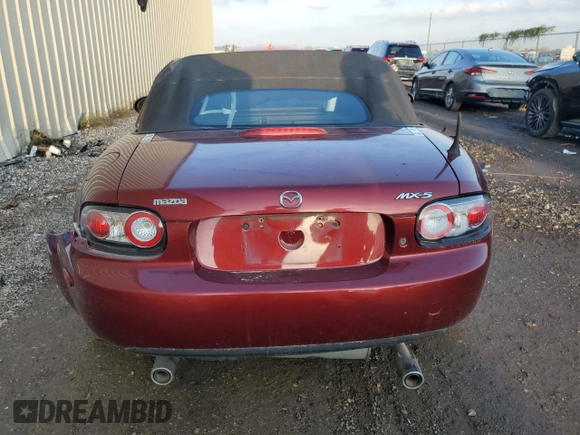2007 Mazda MX-5 Miata Sport z VIN JM1NC25F970124896, wystawiony jako Copart lot #83624394 z przebiegiem 62 735 mil mil oraz Szkoda całkowita • Salvage title. Historia ofert i sprzedaży dostępna na DreamBid. Obrazek 6.