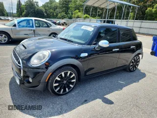 2015 MINI Hardtop 4 Door S with VIN WMWXU3C5XF2B66597, listed as a Copart auction lot 63489985 with Not provided miles and Salvage title. Bid and sale history available at DreamBid. Image 1.