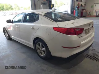 2015 Kia Optima LX z VIN KNAGM4A79F5528215, wystawiony jako IAAI lot #42317163 z przebiegiem 215 395 mil mil oraz . Historia ofert i sprzedaży dostępna na DreamBid. Obrazek 3.