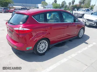 2014 Ford C-Max Energi SEL with VIN 1FADP5CU6EL502547, listed as a IAAI auction lot 42057583 with 83,026 mi miles. Bid and sale history available at carsss.com. Image 4.