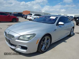 2015 BMW 6 Series 650i z VIN WBA6B2C55FGB99196, wystawiony jako IAAI lot #42107698 z przebiegiem 74 393 mil mil oraz . Historia ofert i sprzedaży dostępna na DreamBid. Obrazek 2.