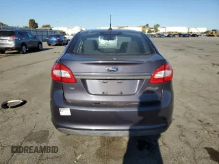 2013 Ford Fiesta SE z VIN 3FADP4BJ9DM186382, wystawiony jako Copart lot #67754934 z przebiegiem 157 495 mil mil oraz Szkoda całkowita • Salvage title. Historia ofert i sprzedaży dostępna na DreamBid. Obrazek 6.
