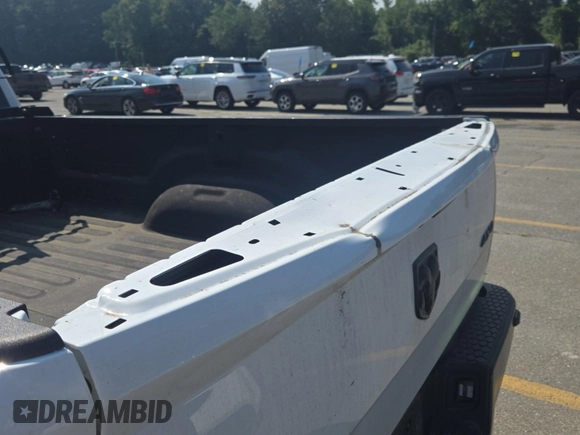 2022 Ram 1500 Tradesman with VIN 3C6JR7DG7NG276051, listed as a IAAI auction lot 42832410 with 29,141 mi miles and . Bid and sale history available at DreamBid. Image 4.