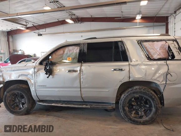 2016 Chevrolet Tahoe LTZ with VIN 1GNSKCKCXGR477284, listed as a IAAI auction lot 42221589 with Not provided miles and . Bid and sale history available at DreamBid. Image 14.