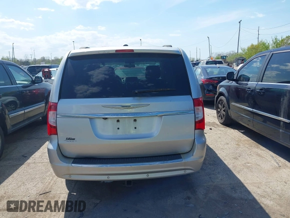 2011 Chrysler Town & Country Touring L with VIN 2A4RR8DG8BR797653, listed as a IAAI auction lot 42115304 with 185,613 mi miles and . Bid and sale history available at DreamBid. Image 16.