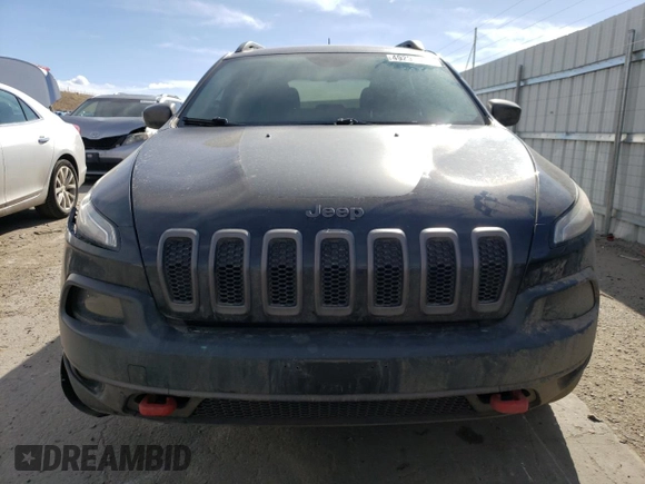 2016 Jeep Cherokee Trailhawk with VIN 1C4PJMBSXGW131199, listed as a Copart auction lot 49292505 with 97,359 mi miles and Salvage Title. Bid and sale history available at DreamBid. Image 5.