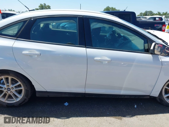 2016 Ford Focus SE z VIN 1FADP3F23GL338496, wystawiony jako IAAI lot #42333608 z przebiegiem 76 972 mil mil oraz . Historia ofert i sprzedaży dostępna na DreamBid. Obrazek 14.