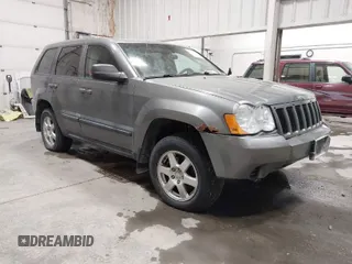 2008 Jeep Grand Cherokee Laredo with VIN 1J8GR48K58C119411, listed as a IAAI auction lot 41637142 with 212,729 mi miles. Bid and sale history available at carsss.com. Image 1.