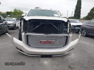 2015 GMC Yukon Denali with VIN 1GKS2CKJ9FR294551, listed as a IAAI auction lot 42162654 with 106,063 mi miles. Bid and sale history available at carsss.com. Image 18.