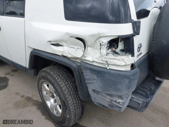 2014 Toyota FJ Cruiser with VIN JTEBU4BF7EK177741, listed as a IAAI auction lot 41871477 with 195,262 mi miles. Bid and sale history available at carsss.com. Image 6.