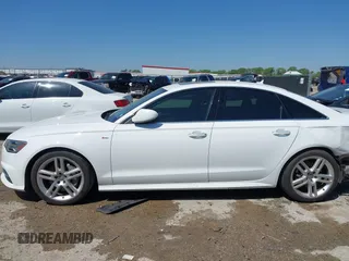 2016 Audi A6 2.0T Premium Plus with VIN WAUGFAFC4GN045229, listed as a IAAI auction lot 41974532 with 122,585 mi miles. Bid and sale history available at carsss.com. Image 14.
