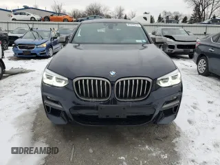 2021 BMW X4 M40i z VIN 5UX2V5C06M9F70459, wystawiony jako Copart lot #87397614 z przebiegiem 35 233 mil mil oraz Szkoda całkowita • Salvage title. Historia ofert i sprzedaży dostępna na DreamBid. Obrazek 5.