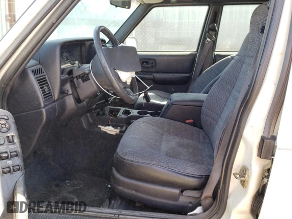 1999 Jeep Cherokee Sport with VIN 1J4FT68S9XL627003, listed as a Copart auction lot 49478595 with 320,444 mi miles and Salvage title. Bid and sale history available at DreamBid. Image 7.