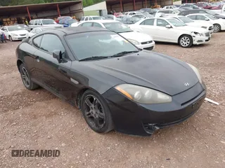 2007 Hyundai Tiburon GT z VIN KMHHN66F37U250320, wystawiony jako IAAI lot #42047654 z przebiegiem 231 899 mil mil oraz . Historia ofert i sprzedaży dostępna na DreamBid. Obrazek 1.
