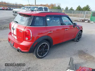 2015 MINI Cooper Countryman S with VIN WMWZC5C51FWP49282, listed as a IAAI auction lot 40698179 with 63,037 mi miles. Bid and sale history available at carsss.com. Image 4.