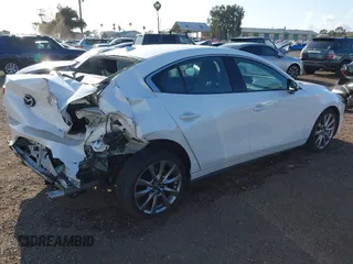 2020 Mazda 3 Premium with VIN 3MZBPAEM3LM132772, listed as a IAAI auction lot 42067269 with 53,751 mi miles and . Bid and sale history available at DreamBid. Image 4.