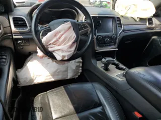 2014 Jeep Grand Cherokee Limited with VIN 1C4RJFBG9EC501136, listed as a Copart auction lot 59873595 with 203,819 mi miles and Salvage title. Bid and sale history available at DreamBid. Image 8.