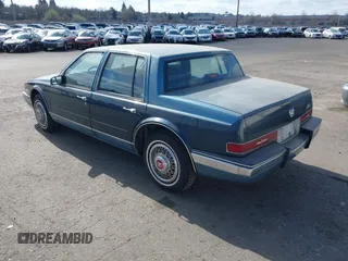1986 Cadillac Seville z VIN 1G6KS6989GU813079, wystawiony jako IAAI lot #41732353 z przebiegiem Nie podano mil oraz . Historia ofert i sprzedaży dostępna na DreamBid. Obrazek 3.