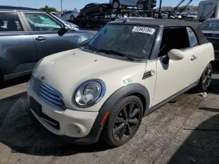 2014 MINI Convertible with VIN WMWZN3C59ET569823, listed as a Copart auction lot 72543194 with 56,730 mi miles and Salvage Title. Bid and sale history available at DreamBid. Image 1.