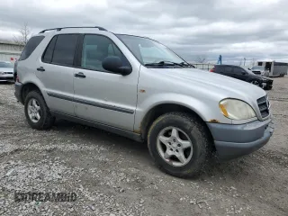 1999 Mercedes-Benz M 320/430/500 with VIN 4JGAB54E9XA127797, listed as a Copart auction lot 51408235 with 243,566 mi miles and Salvage title. Bid and sale history available at DreamBid. Image 4.