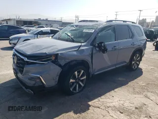 2023 Honda Pilot Touring with VIN 5FNYG2H7XPB011420, listed as a Copart auction lot 69799314 with 9,601 mi miles and Salvage Title. Bid and sale history available at carsss.com. Image 1.