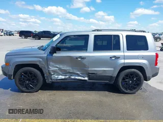 2014 Jeep Patriot Sport z VIN 1C4NJPBA7ED818830, wystawiony jako IAAI lot #42216964 z przebiegiem 144 909 mil mil oraz . Historia ofert i sprzedaży dostępna na DreamBid. Obrazek 14.