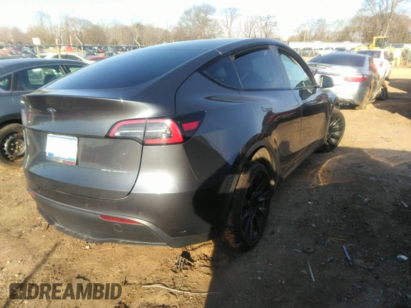 2022 Tesla Model Y Long Range with VIN 7SAYGDEE9NF424928, listed as a IAAI auction lot 41807225 with Not Provided miles and . Bid and sale history available at carsss.com. Image 4.