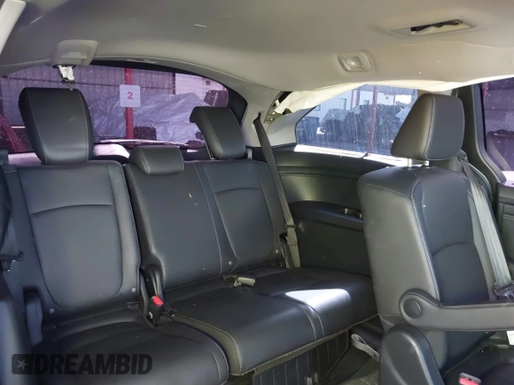 2024 Honda Odyssey Touring with VIN 5FNRL6H82RB027601, listed as a IAAI auction lot 41808680 with 25,911 mi miles and . Bid and sale history available at DreamBid. Image 8.
