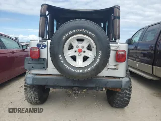 2003 Jeep Wrangler Rubicon z VIN 1J4FA69S53P340085, wystawiony jako Copart lot #74564574 z przebiegiem Nie podano mil oraz Szkoda całkowita • Salvage title. Historia ofert i sprzedaży dostępna na DreamBid. Obrazek 6.