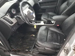 2009 Ford Focus SES with VIN 1FAHP36N19W214689, listed as a Copart auction lot 43001385 with 295,859 mi miles and Salvage Title. Bid and sale history available at carsss.com. Image 7.