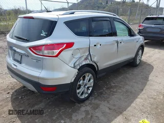 2016 Ford Escape Titanium with VIN 1FMCU9JX3GUA62802, listed as a IAAI auction lot 42001690 with 124,452 mi miles. Bid and sale history available at carsss.com. Image 4.
