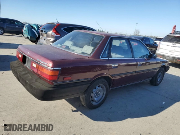 1990 Toyota Camry z VIN JT2SV21E7L3411990, wystawiony jako Copart lot #88557555 z przebiegiem 335 803 mil mil oraz Szkoda całkowita • Salvage title. Historia ofert i sprzedaży dostępna na DreamBid. Obrazek 3.