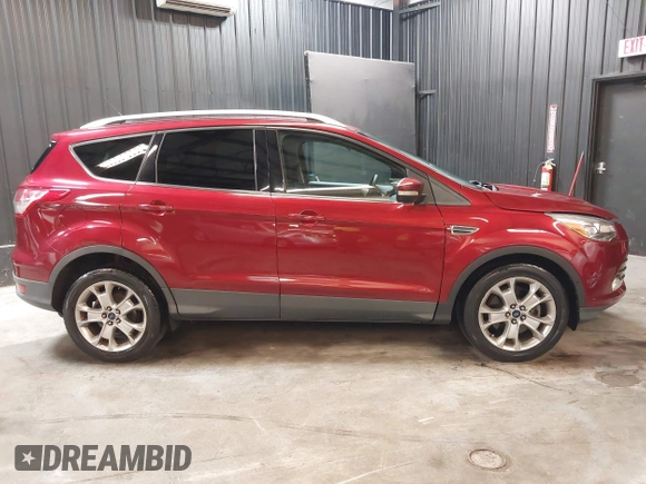 2014 Ford Escape Titanium with VIN 1FMCU9J9XEUD69589, listed as a IAAI auction lot 42031882 with 123,632 mi miles and . Bid and sale history available at DreamBid. Image 13.
