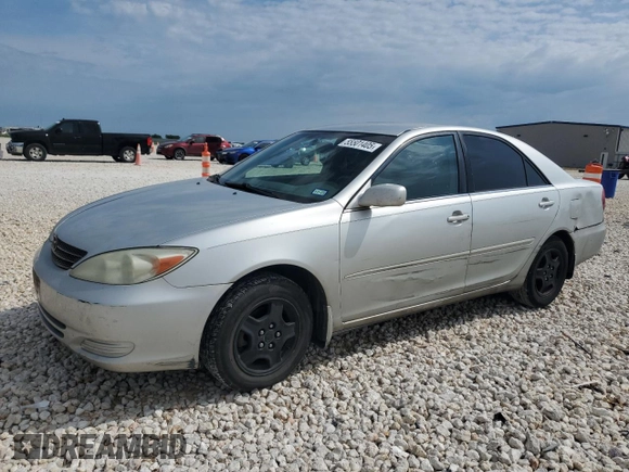 2002 Toyota Camry XLE z VIN 4T1BF32K12U519069, wystawiony jako Copart lot #55501405 z przebiegiem 186 142 mil mil oraz Szkoda całkowita • Salvage title. Historia ofert i sprzedaży dostępna na DreamBid. Obrazek 1.