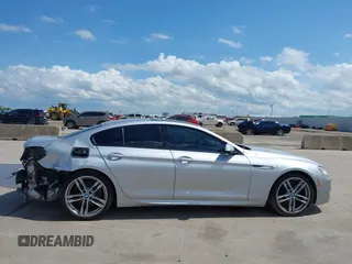 2015 BMW 6 Series 650i z VIN WBA6B2C55FGB99196, wystawiony jako IAAI lot #42107698 z przebiegiem 74 393 mil mil oraz . Historia ofert i sprzedaży dostępna na DreamBid. Obrazek 14.