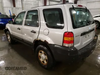 2007 Ford Escape XLS with VIN 1FMCU92Z77KA84801, listed as a Copart auction lot 82052144 with 180,774 mi miles and Salvage title. Bid and sale history available at DreamBid. Image 2.