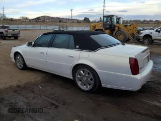 2004 Cadillac DeVille DTS z VIN 1G6KF57944U122824, wystawiony jako Copart lot #86147994 z przebiegiem 118 156 mil mil oraz Szkody całkowita. Historia ofert i sprzedaży dostępna na DreamBid. Obrazek 2.