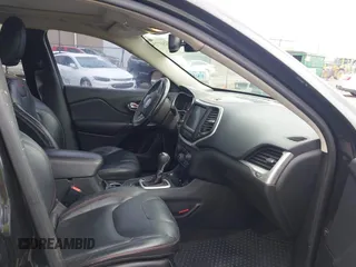 2015 Jeep Cherokee Trailhawk with VIN 1C4PJMBS5FW647601, listed as a IAAI auction lot 42437734 with 170,640 mi miles and . Bid and sale history available at DreamBid. Image 5.
